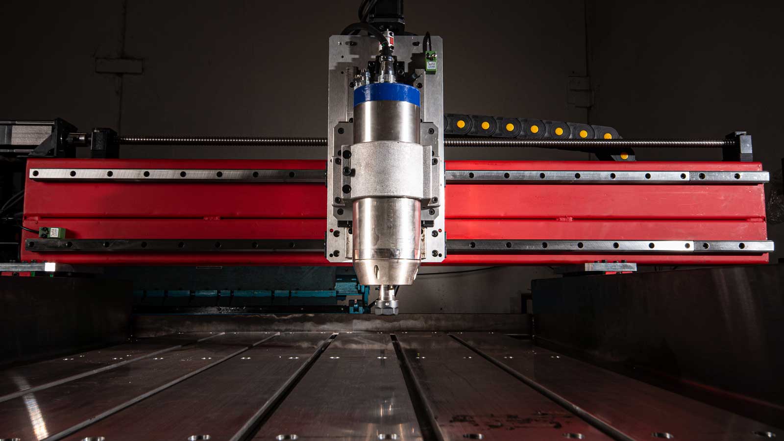 A cnc machine is working on a piece of metal.